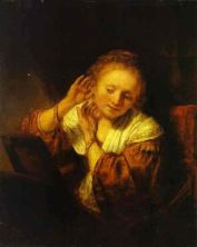 Haga click para ver la imagen ampliada a young woman trying on earings.jpg